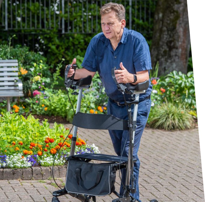 A man using a forearm mobility walker