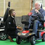 Ben Upson talking to a visitor at The Motability One Big Day Event