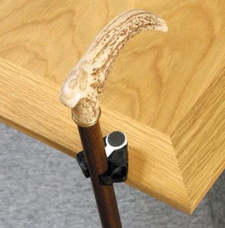 Cane & Crutch Holder clipped to a table