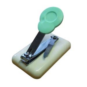 A table top finger nail clipper for people with restricted mobility and disabilities