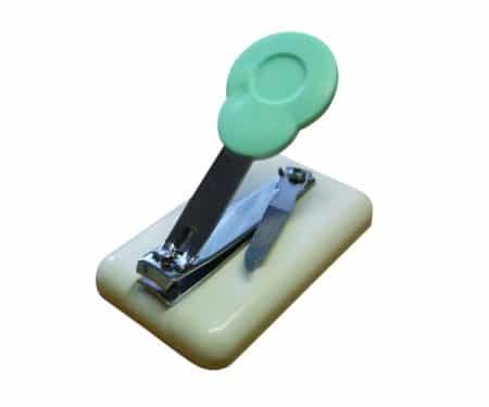 A table top finger nail clipper for people with restricted mobility and disabilities