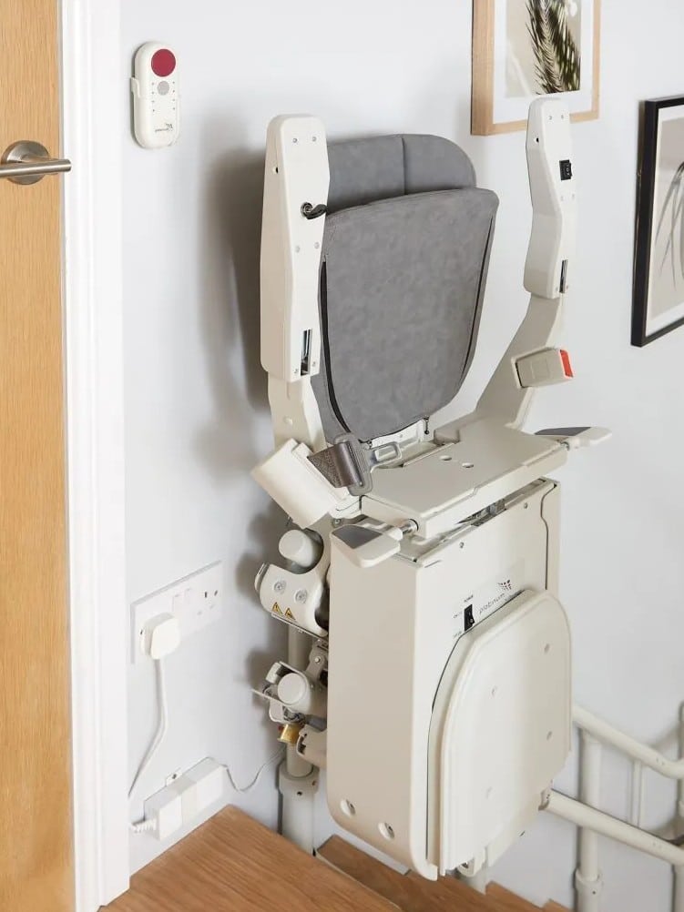 ergo curve stairlift at the top of the stairs space saving