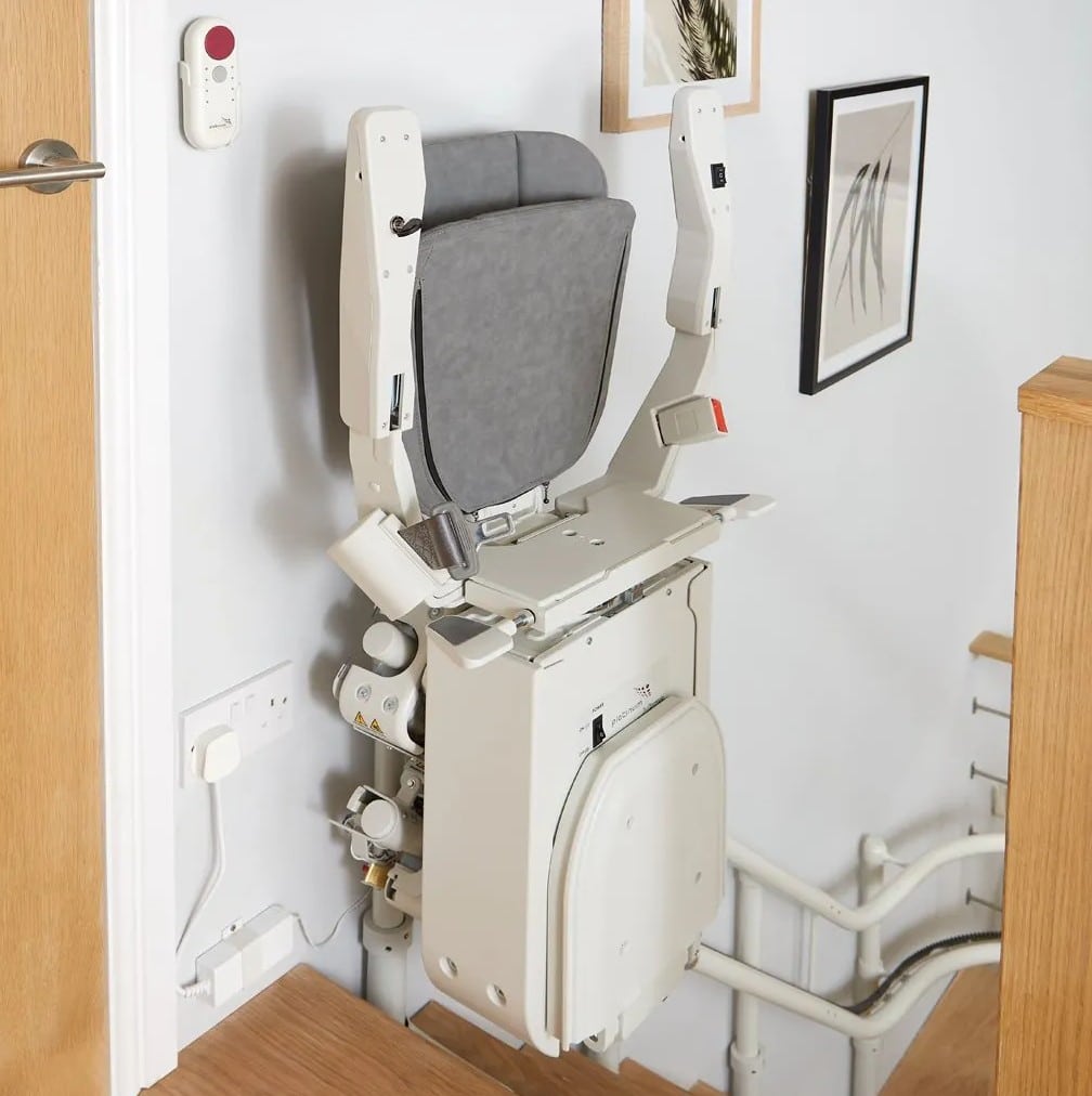 ergo curve stairlift at the top of the stairs space saving