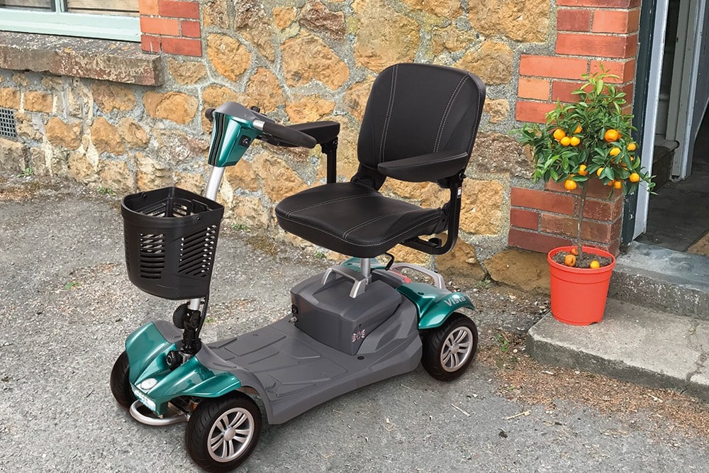 Vista Liteway Aston Green mobility scooter parked outside a building